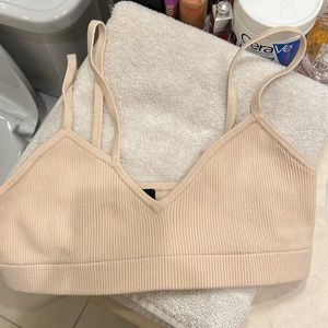 h:ours bralette. Elastic hem with ribbed jersey fabric. Strappy design at top.